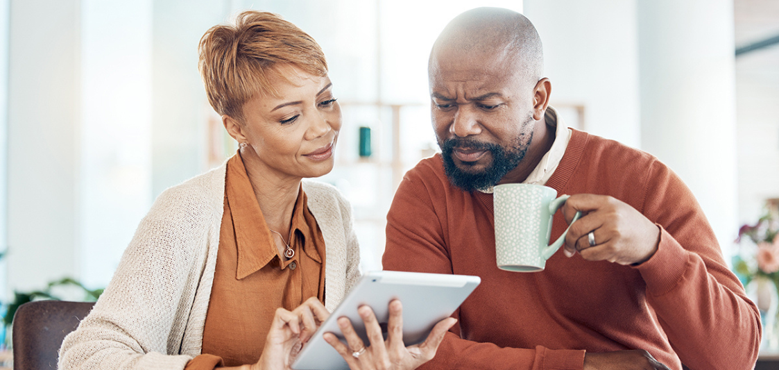 Image of couple reading about VA benefits and taxes