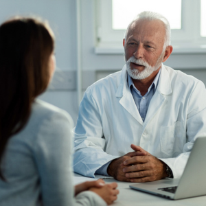 Doctors asing question with female patient