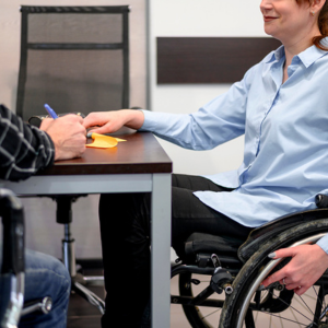 Woman wheelchair desk listening